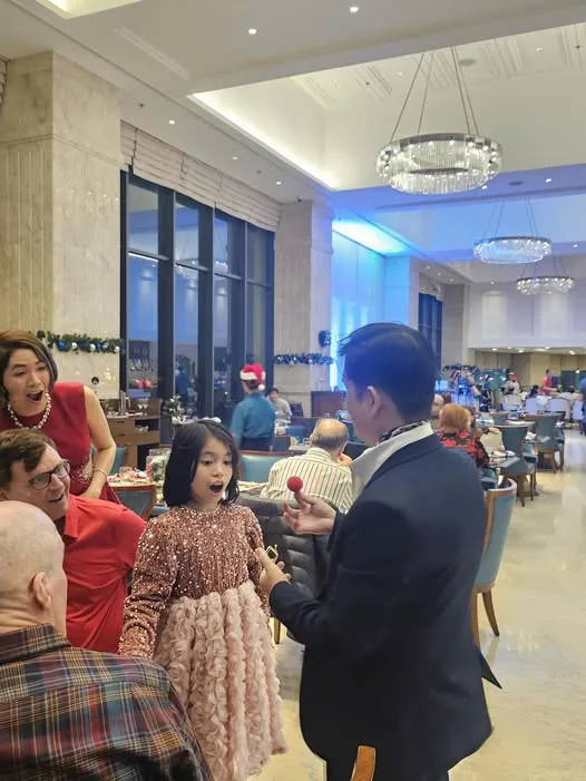 Randy Huynh entertaining international guests at a hotel event in Da Nang